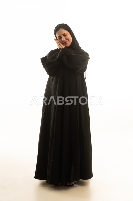 Saudi Woman in Abaya Making Sleeping Gesture on White