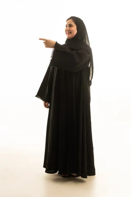 Saudi Woman in Abaya Pointing on White Background
