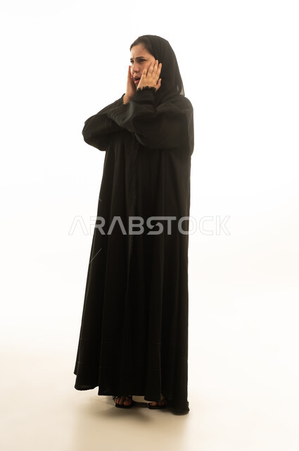 Shocked Saudi Woman in Black Abaya on White Background