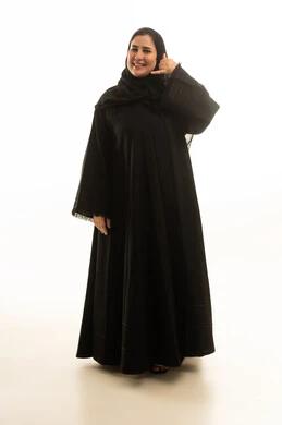 Saudi Woman in Black Abaya Making Phone Call Gesture