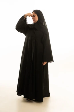 Saudi Woman in Abaya Pinching Nose in Disgust