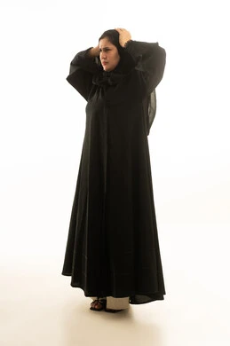 Stressed Saudi Woman in Black Abaya on White Background