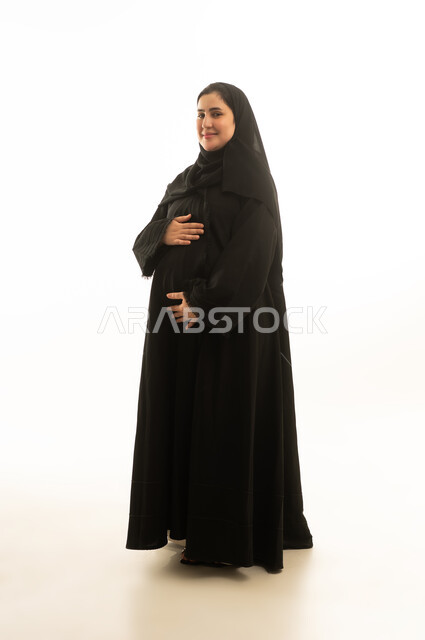 Pregnant Saudi Woman in Black Abaya on White Background