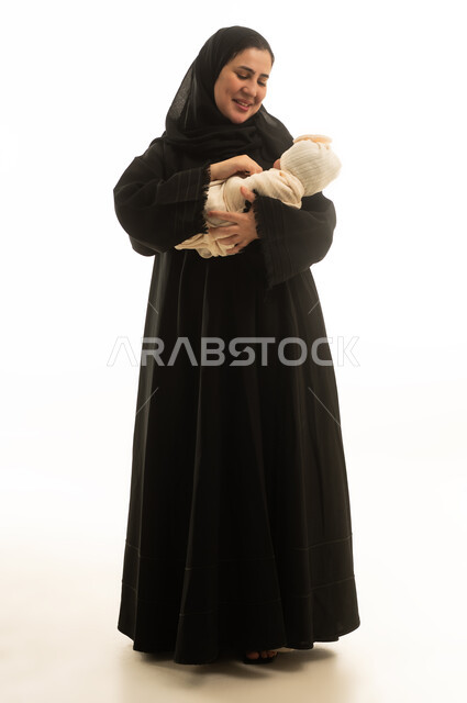 Saudi Mother in Black Abaya Holding Newborn Baby