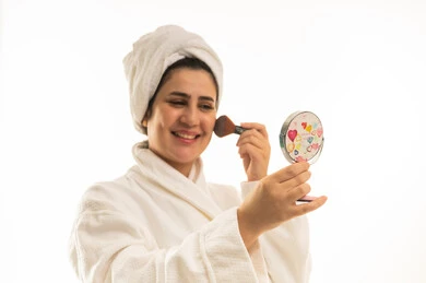 Arab Woman in White Bathrobe Applying Makeup
