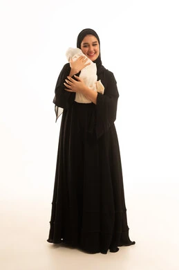 Saudi Woman in Black Abaya Holding Newborn Baby