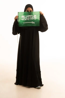 Saudi Woman Holding National Flag on White Background