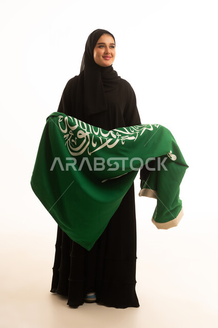 Saudi Woman in Abaya Holding Green National Flag