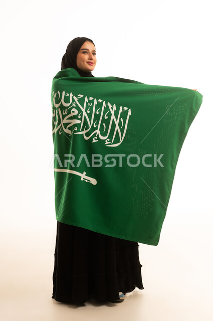 Saudi Woman Wearing Abaya Wrapped in National Flag