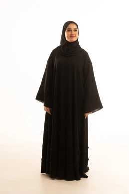Saudi Woman in Traditional Black Abaya on White Background