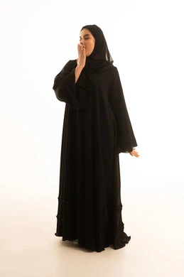 Saudi Woman in Black Abaya Yawning on White Background