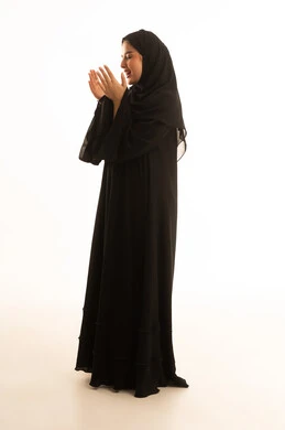 Saudi Woman Praying in Black Abaya Studio Shot
