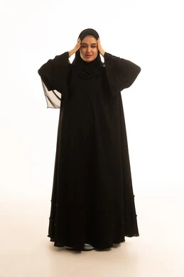 Saudi Woman in Black Abaya with Headache Studio Portrait