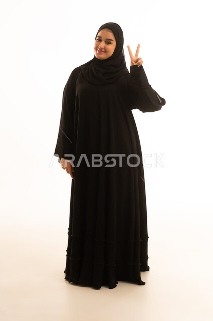 Saudi Woman in Abaya Making Peace Sign on White Background
