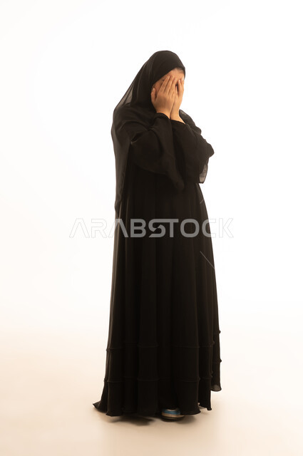 Saudi Woman in Black Abaya Covering Face on White