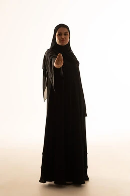 Saudi Woman in Black Abaya Making Hand Gesture