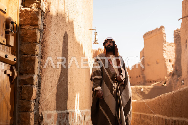 An Arab Saudi Gulf man wearing the founding day attire stands with pride and dignity in the history of the Kingdom, commemorating the establishment of the first Saudi state by Imam Muhammad bin Saud, on the day we began, February 22, 1727. The historical and civilizational depth of the Kingdom is the identity of the 92nd Saudi National Day.