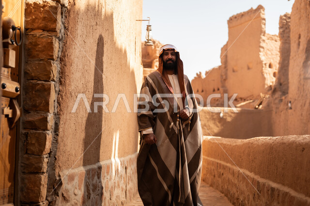 An Arab Saudi Gulf man wearing the founding day attire stands with pride and dignity in the history of the Kingdom, commemorating the establishment of the first Saudi state by Imam Muhammad bin Saud, on the day we began, February 22, 1727. The historical and civilizational depth of the Kingdom is the identity of the 92nd Saudi National Day.