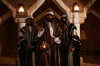 A popular neighborhood with traditional mud houses, a holiday and a national occasion, the anniversary of the founding of the first Saudi state on February 22, showing love and loyalty to the state and the homeland, three Arab Gulf Saudi men wearing traditional folk attire, a lit traditional lantern, pride and honor in national identity, the day we began in 1727 AD. A popular neighborhood with traditional mud houses, a holiday and a national occasion, the anniversary of the founding of the first Saudi state on February 22, showing love and loyalty to the state and the homeland, three Arab Gulf Saudi men wearing traditional folk attire, a lit traditional lantern, pride and honor in national identity, the day we began in 1727 AD.