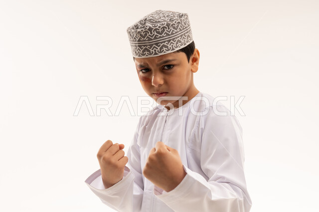 Omani Boy in Traditional Dress Boxing Pose