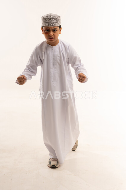 Angry Omani Boy in Traditional Dishdasha and Kuma