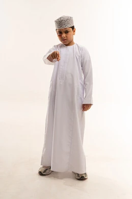 Omani Boy in Traditional Dishdasha Pointing Angry