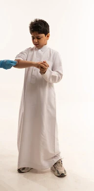 Saudi Boy Receiving Medical Treatment on White Background
