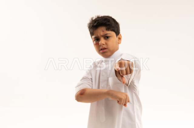 Angry Saudi Boy with Bruises Pointing Finger