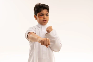 Arab Boy with Facial Bruises in Fighting Stance