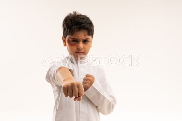 Arab Boy in White Thobe Punching with Bruised Eye