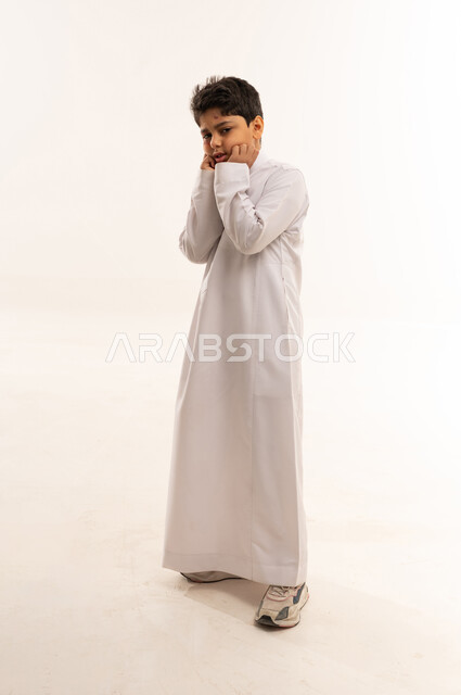 Saudi Boy in White Thobe on White Background