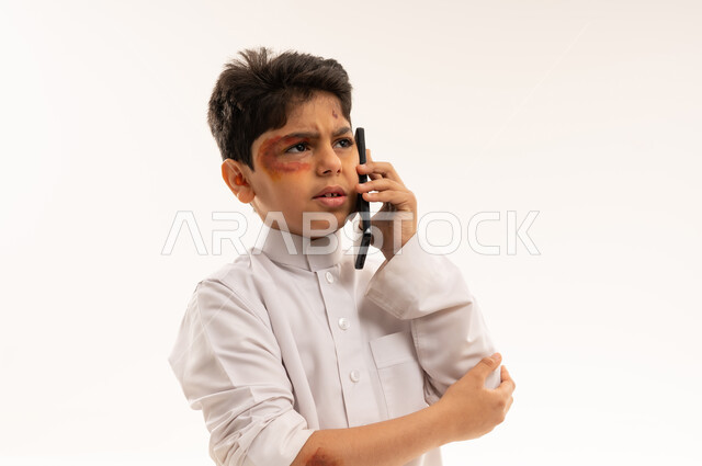 Injured Saudi Boy Making Emergency Phone Call