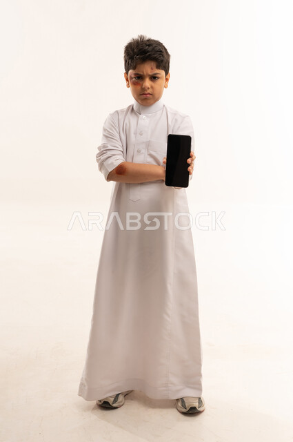 Injured Saudi Boy Holding Smartphone on White Background