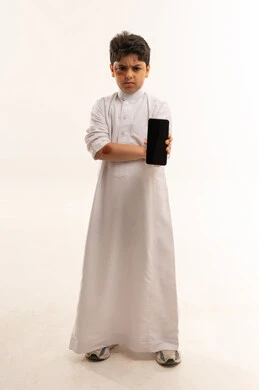 Injured Saudi Boy Holding Smartphone on White Background