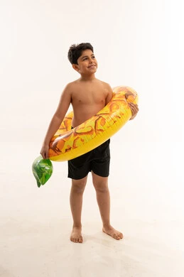 Middle Eastern Boy Holding Inflatable Swim Ring