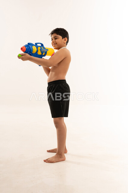 Saudi Boy with Water Gun on White Background