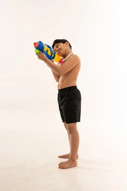 Arab Boy with Water Gun in Studio