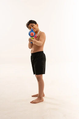 Saudi Boy Playing with Water Gun on White Background