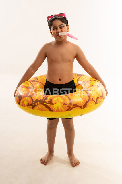 Saudi Boy with Snorkeling Gear and Swim Ring