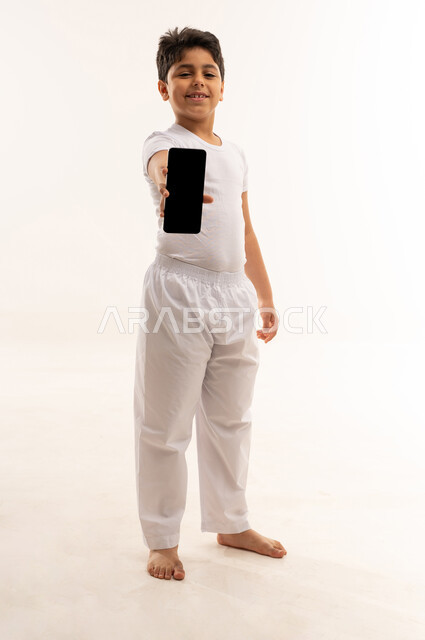 Arab Boy Holding Smartphone on White Background
