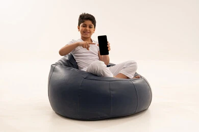 Arabic Boy Holding Blank Smartphone Screen in Studio