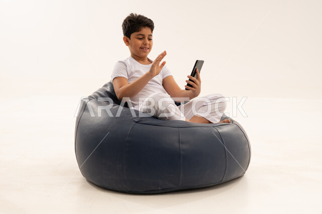 Saudi Boy on Video Call with Smartphone