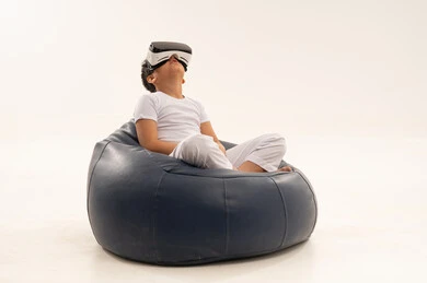 Arab Boy Using VR Headset Sitting on Beanbag