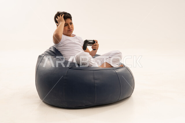Arab Boy Frustrated Playing Video Games in Studio