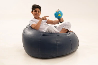 Arab Boy Holding Globe on Bean Bag Chair