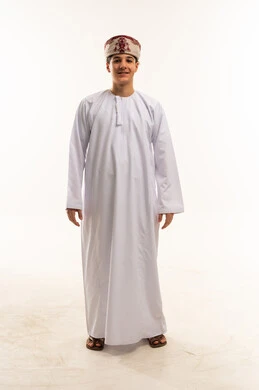Omani Boy in Traditional Dishdasha on White Background