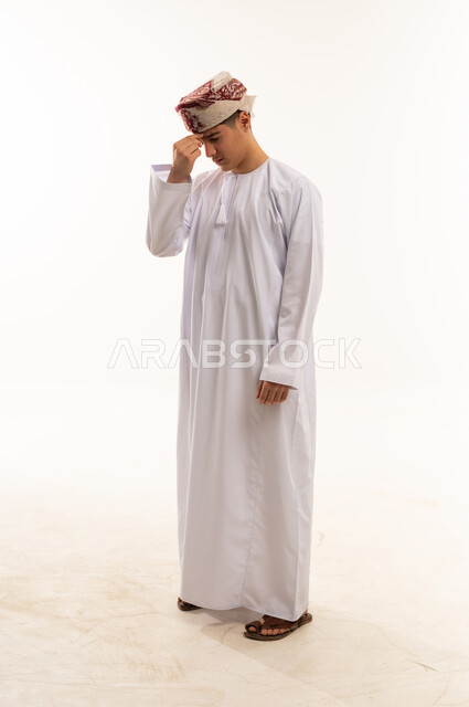 Omani Man in Traditional Dress with Headache