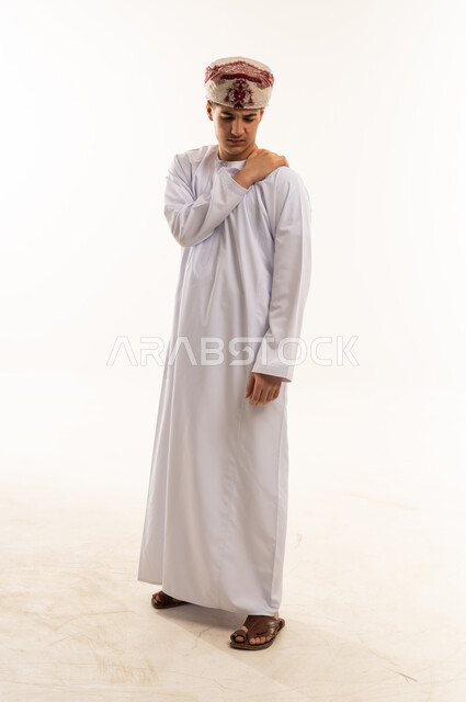 Omani Man in Traditional Dress with Shoulder Pain