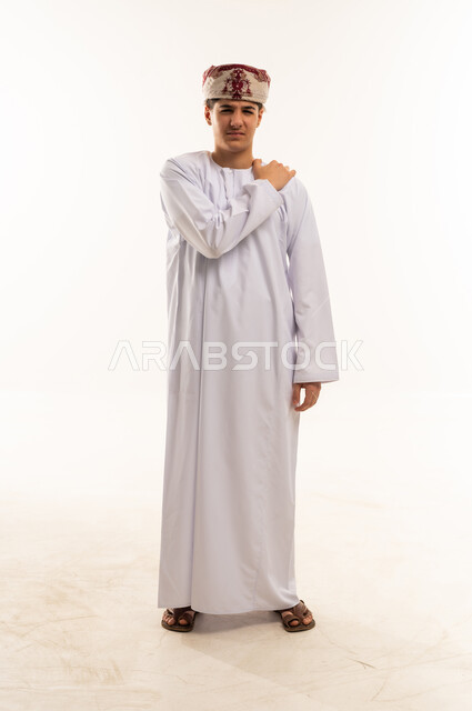 Omani Man in Traditional Dress with Shoulder Pain