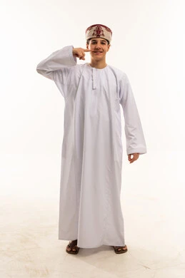 Omani Teenager in Traditional Dishdasha on White Background